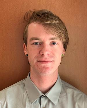 A person in a button up shirt

Description automatically generated