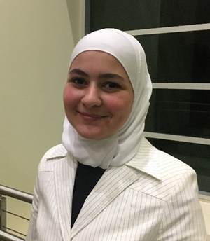 A person in a white suit

Description automatically generated