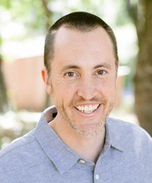 A close-up of a person smiling

Description automatically generated